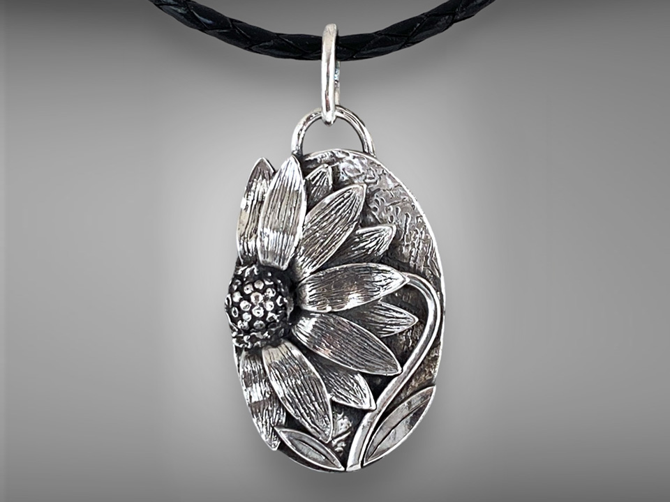 Silver sunflower pendant