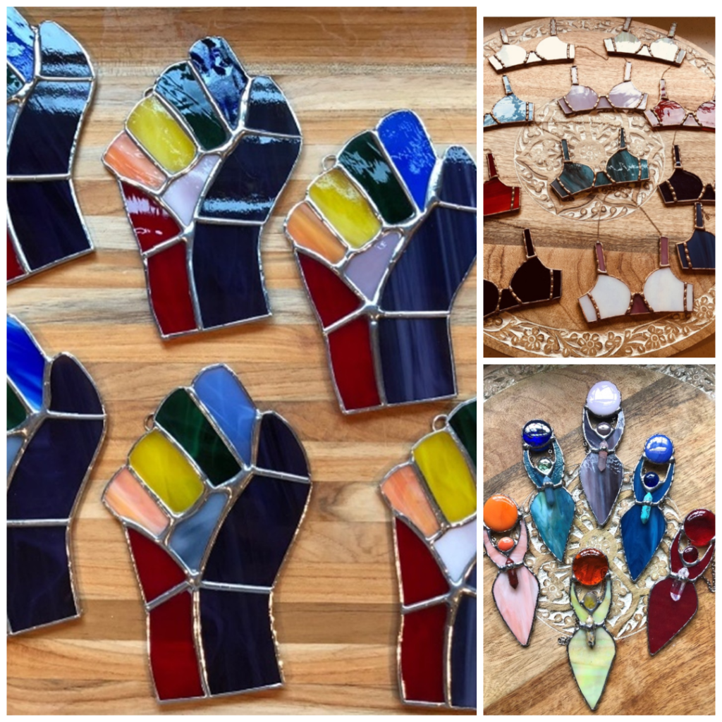 Collage of stained glass empowerment symbols including fist, female form, and bra