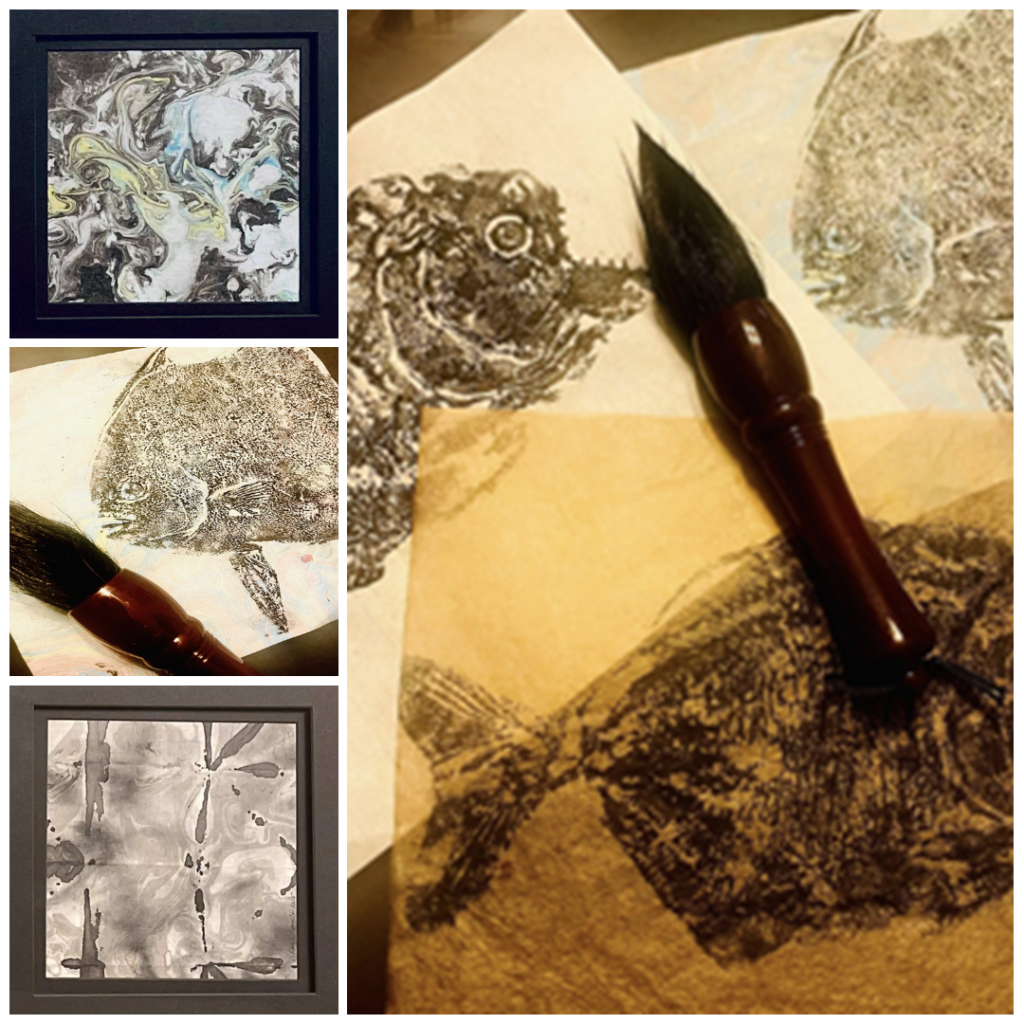 Collage of ink abstract ink prints and fish prints with paintbrush on desk