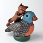 Polymer clay bird and cat by artist Eileen Cressman-Reeder