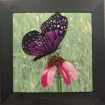 Fiber wall art of butterfly on flower