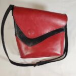 Red and black leather handbag by artist Claudio Trudu
