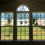 Blue stained glass art on windows by Tina Feldi