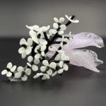 Glass white flowers on branch