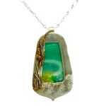 Necklace pendant with blue/green stone by artist Jo-Anne Frazier