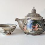 Teapot and cup by artist Julia Castor