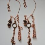 Copper colored earwrap by artist Louise Devery