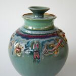 Green pot lizard, frog, dragonfly details and lid by artist Marsha Dowshen