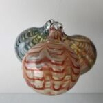 Three colorful glass hanging orbs