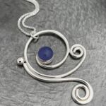 Necklace with pendant with purple stone